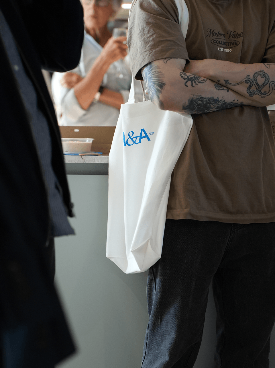 bag, adult, male, man, person, female, woman, handbag, clothing, pants