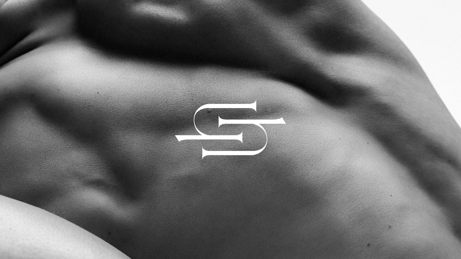 person, skin, back, body part, symbol, number, text